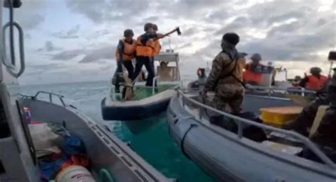 Filipino soldiers fought off Chinese coast guard 'with bare hands'.